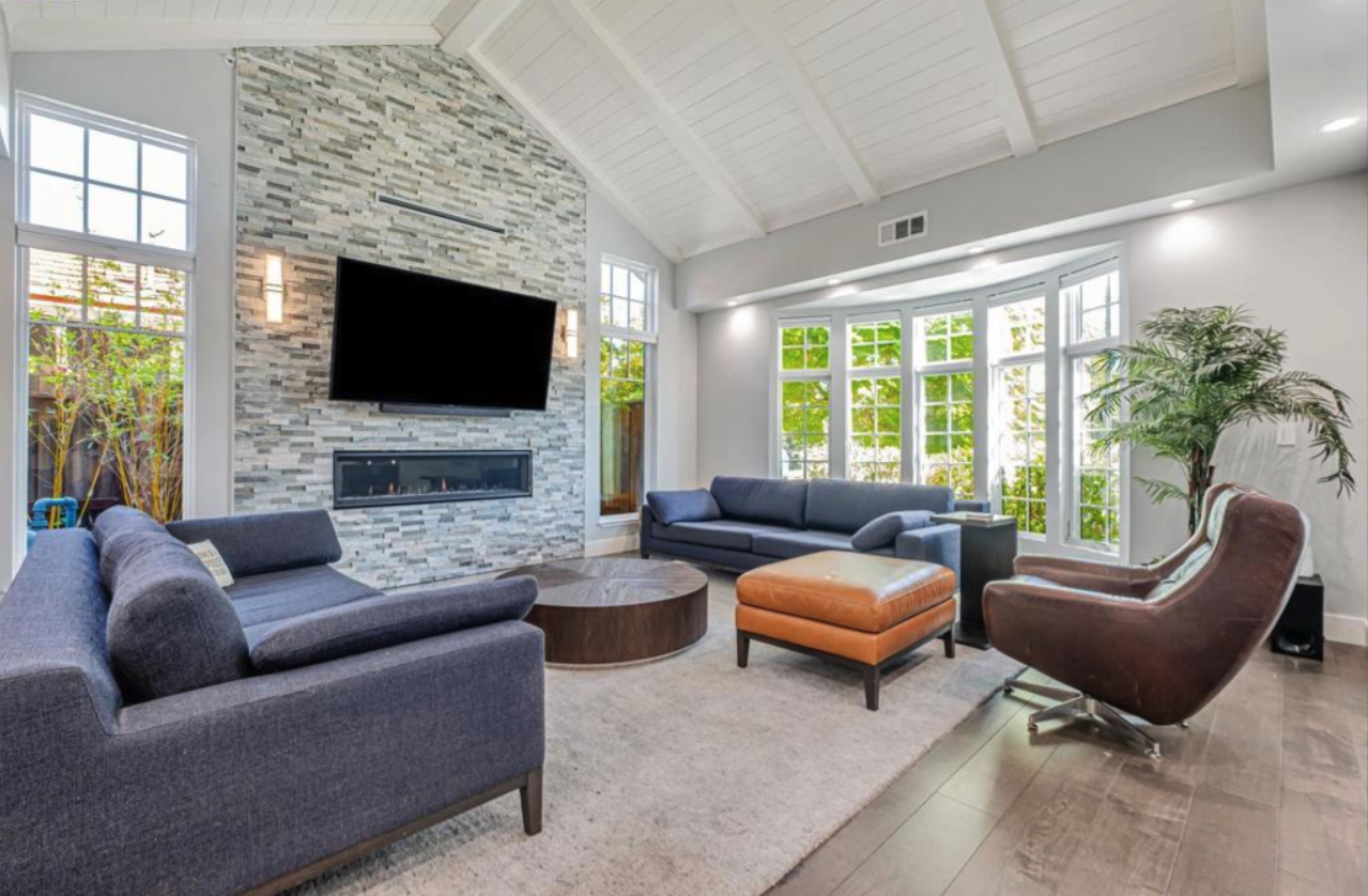 Fremont Craftsman — living room with vaulted ceiling and stone fireplace